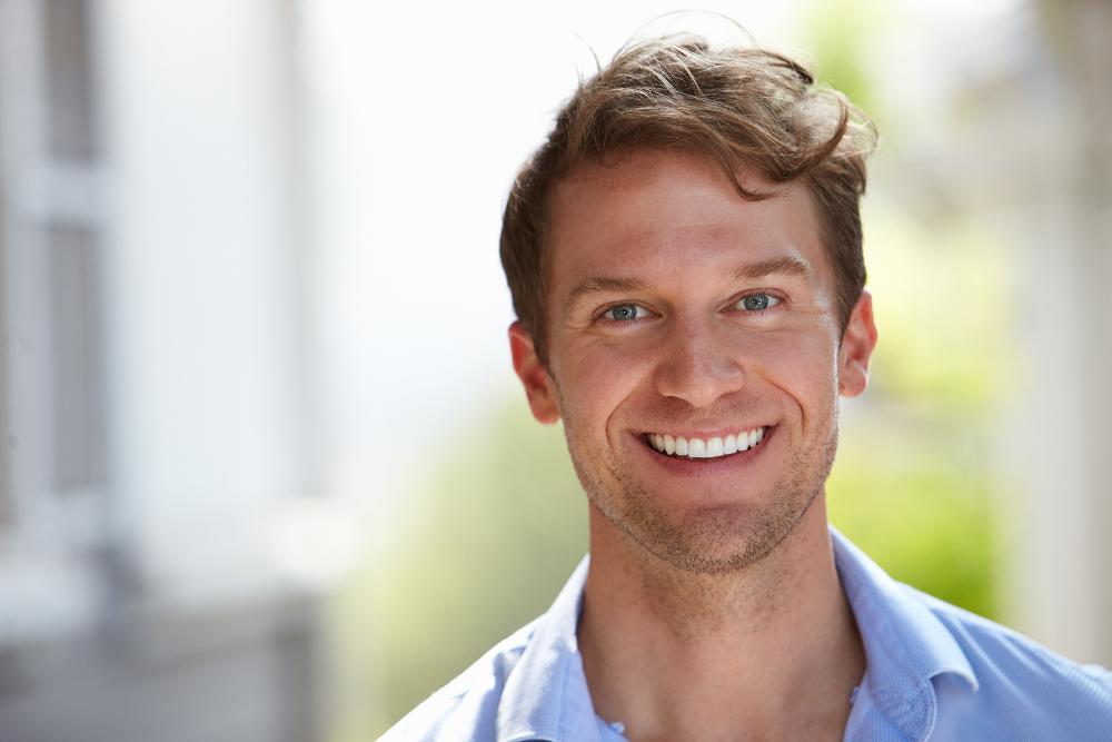 man smiling after periodontal treatment in havertown