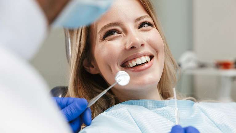 woman smiling in dental chair in havertown