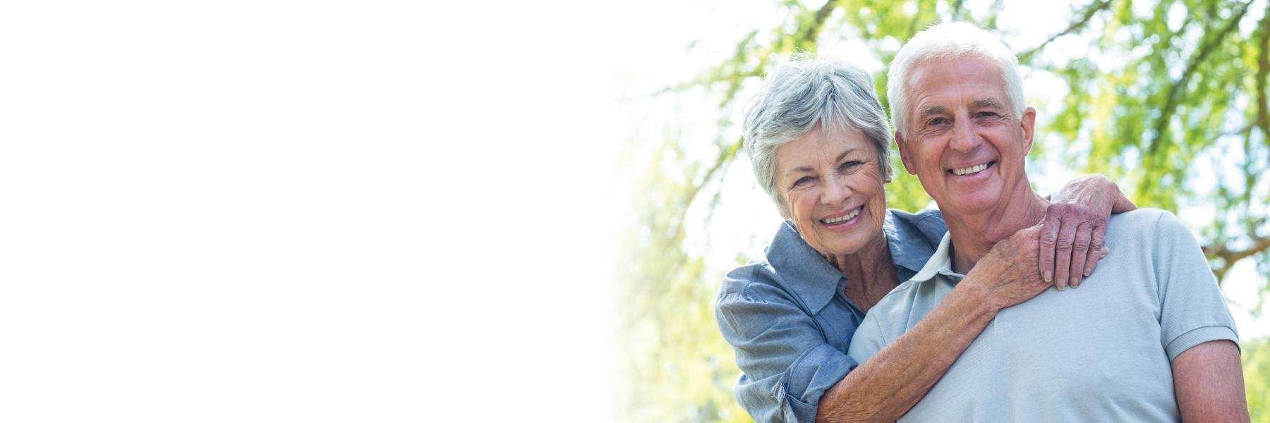 older man and woman smiling